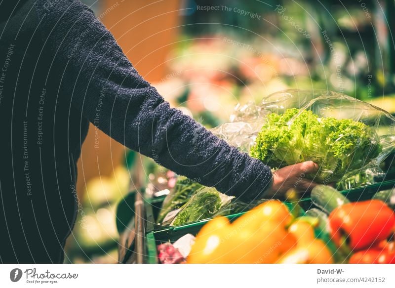 Food - Woman shopping in the vegetable department Vegetable Shopping Products plastic Plastic packaging Hand Store premises salubriously Supermarket Customer