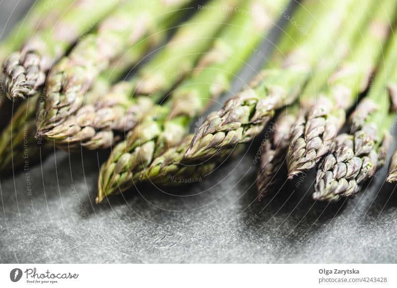 Fresh asparagus on table. green fresh food gray selective focus close up vegetable healthy raw organic steam tied vegetarian seasonal background