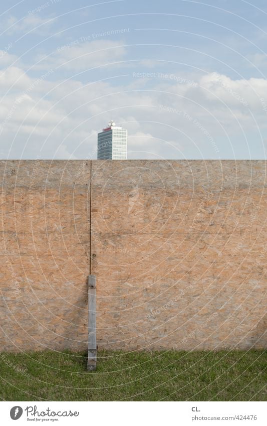 barrier Environment Nature Sky Clouds Beautiful weather Grass Meadow Town High-rise Building Architecture Wall (barrier) Wall (building) Facade Gloomy