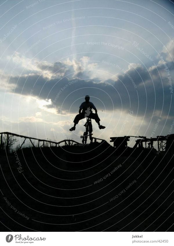 Bike into the night Bicycle 1 Human being Sky Clouds Movement Driving Jump Mountain bike Extreme sports Exterior shot Evening Twilight Light Shadow Contrast