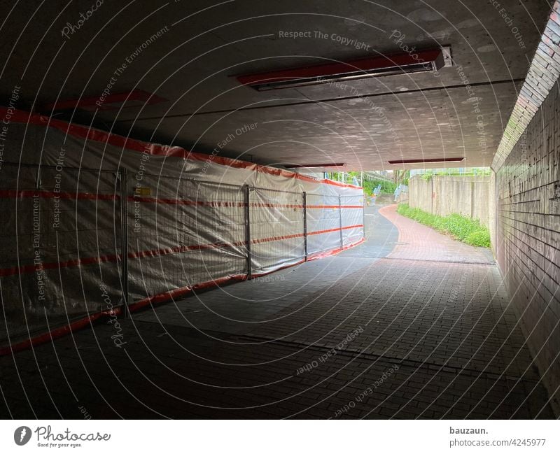 construction fence. Construction site Hoarding Underpass Cycle path Footpath Rail underpass Lanes & trails Street Traffic infrastructure Deserted Exterior shot