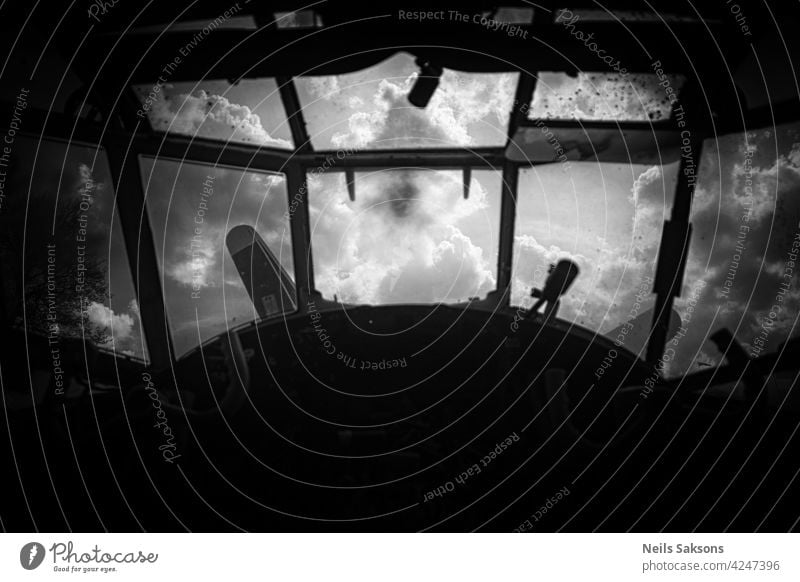 Old abandoned airplane cockpit view and sky background on window cabin pilot interior aircraft aviation control panel dashboard steering wheel transportation