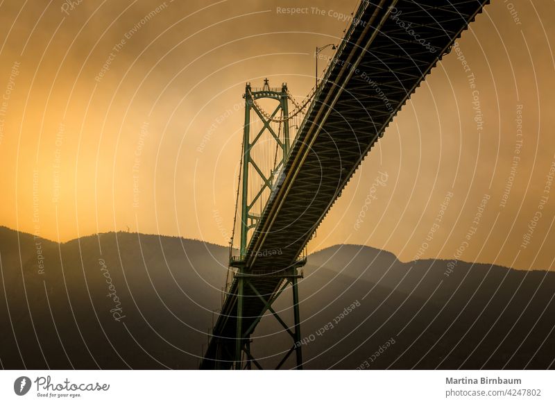 The Lions Gate Bridge in Vancouver, Cananda vancouver bridge lions gate traffic park canada landscape travel architecture colors clouds city cars north america