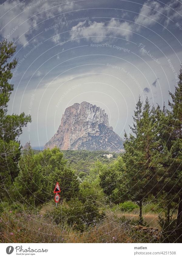 Slope 12 % Incline Landscape mountain Cliff Forest street sign Ocean Sky Beautiful weather Ibiza isla de es vedra