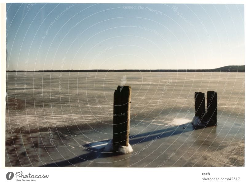 frozen lake Colour photo Exterior shot Deserted Copy Space left Copy Space top Evening Twilight Shadow Long shot Vacation & Travel Winter Water Cloudless sky