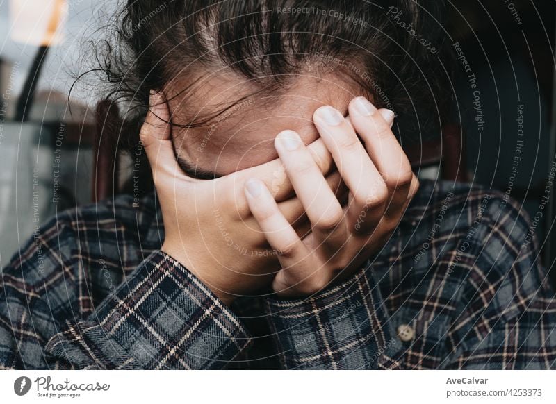 Woman worried while showing off the window in the city during a spring day, mental health concept counseling help patient problem psychological psychologist