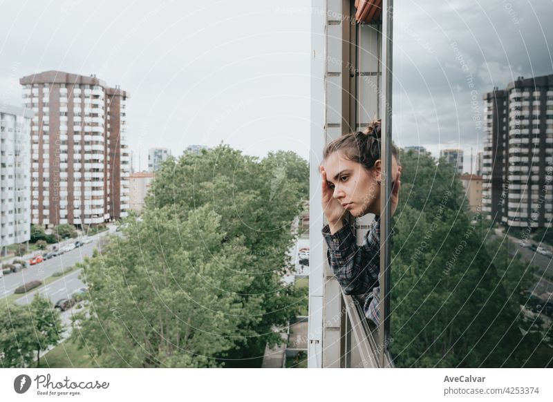 Woman worried while showing off the window in the city during a spring day, mental health concept anxiety woman frustration problem sad sadness solitude sorrow