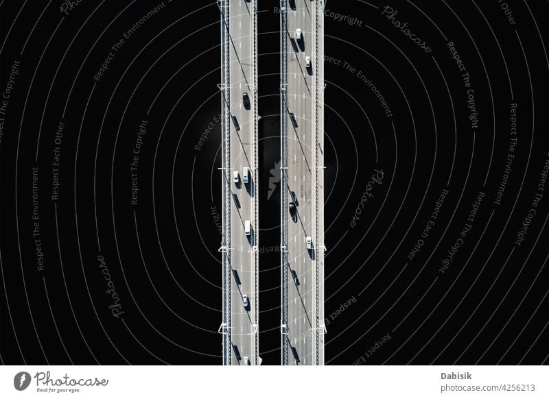 Aerial view of bridge over river with cars aerial transport road traffic above highway travel top overhead city jam water urban construction new architecture