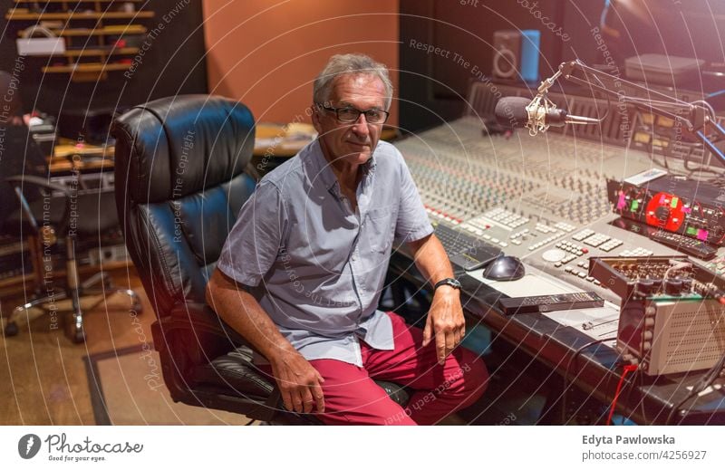 Mature man at mixing desk in a recording studio senior men male people lifestyle enjoying real people casual adult one person Caucasian aged mature elderly