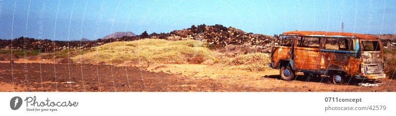 parked bus on Fuerteventura Spain Desert Loneliness Adventure Vintage car Trash Beach Breakdown Calm Transport Bus Parking Sand stage Blaze throwaway society