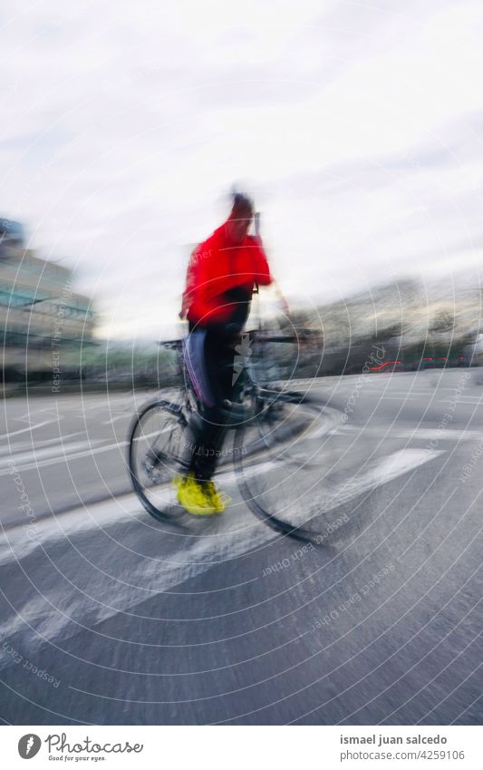 cyclist on the street in Bilbao city spain biker bicycle transportation cycling biking exercise lifestyle ride speed fast road urban outdoors people bilbao Blur