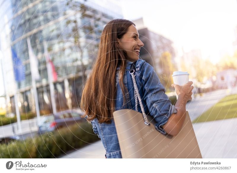 Portrait of young woman in the city urban street active people young adult casual attractive female happy Caucasian enjoying one person beautiful positivity