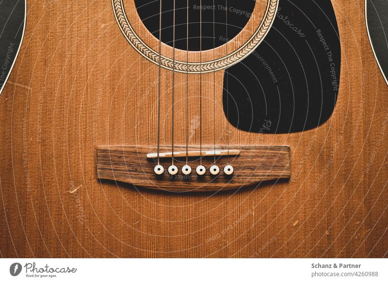 Western guitar in the cut Guitar Music Make music tool Musical instrument Wood Wood grain Veneer Wooden ceiling Guitar strings Acoustic Sound