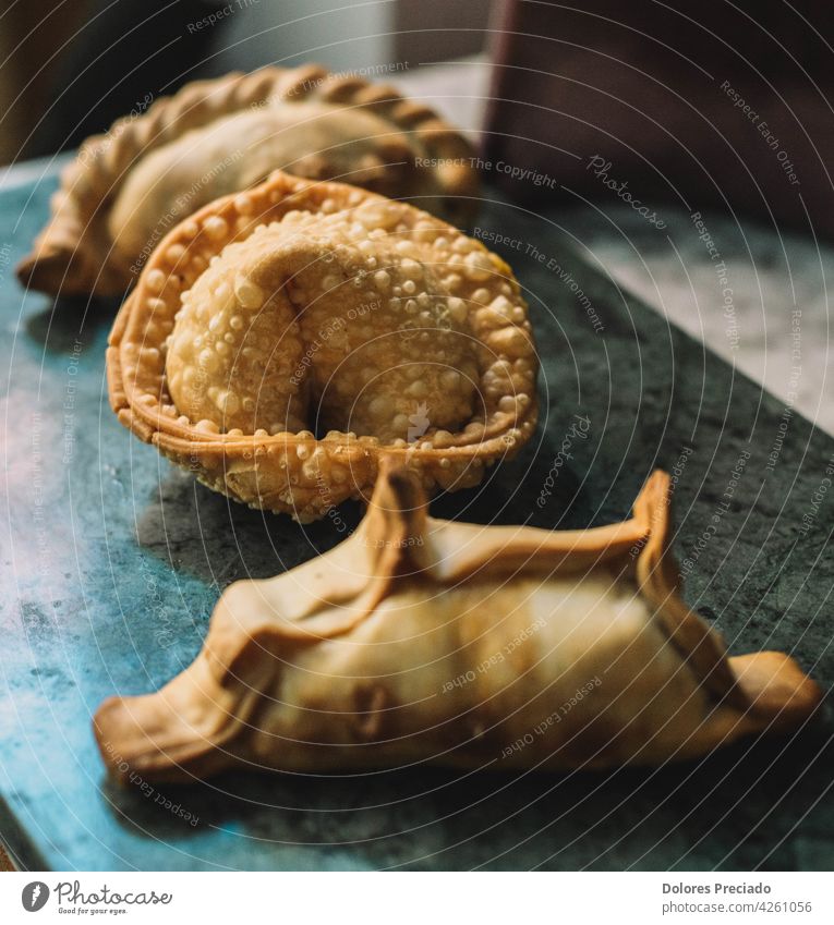 Assorted stuffed empanadas typical of South America pastel homemade lunch antipasto chicken appetizer ethnic latin cooked hispanic table pastry cooking