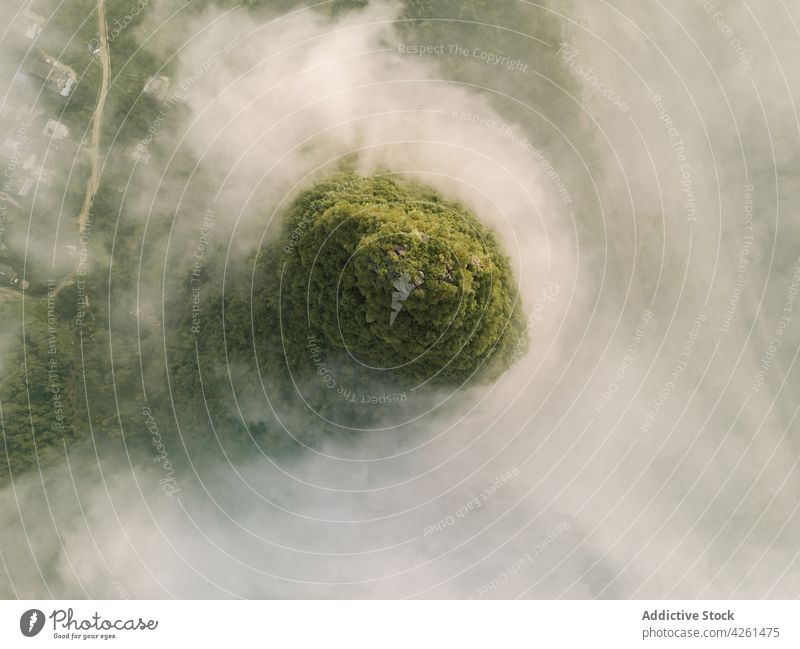 Green rock on foggy day in city atmosphere nature highland landscape environment ecology air diffuse spread haze weather mist tree vegetate picturesque