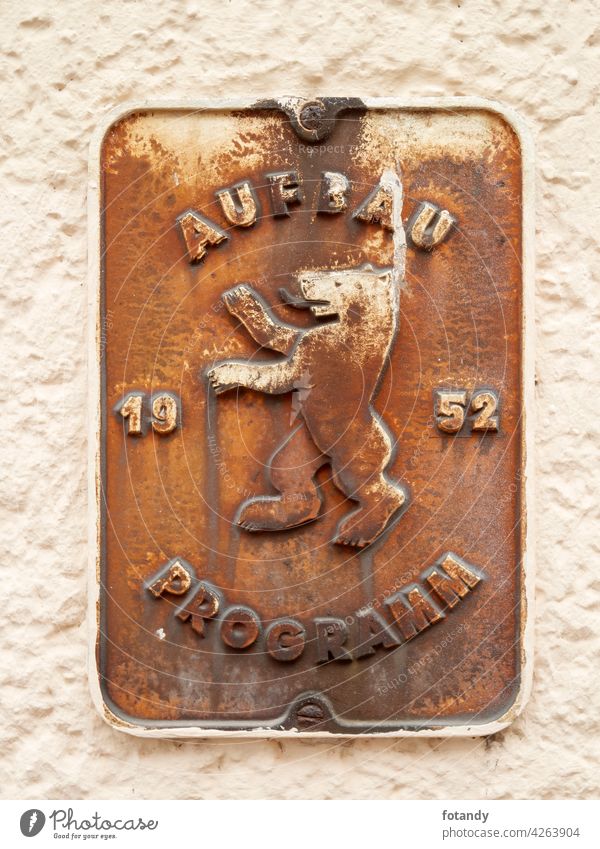 Berlin, Germany - March 07, 2019: Old original metal sign "Aufbau Programm Berlin 1952" on a house wall in Berlin-Kreuzberg. object Detail Arcitecture