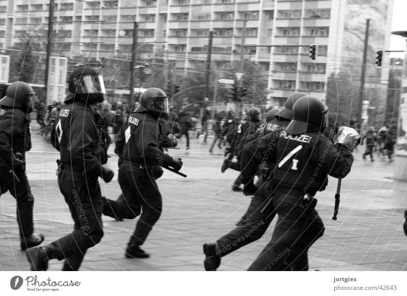 On the run Police Officer Police Force Group Workwear Protective clothing Helmet Running Walking Aggression Rebellious Town Fear Politics and state Change