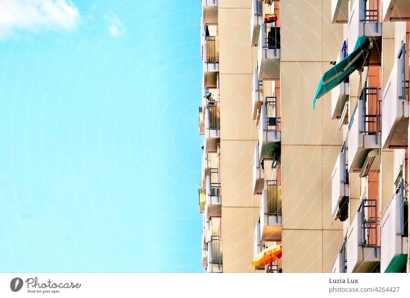 Vertical in spring: balconies lined up on a high-rise building High-rise Facade Architecture Building Town Sky Day Spring Sun Clouds sunshine Sunshade Direct