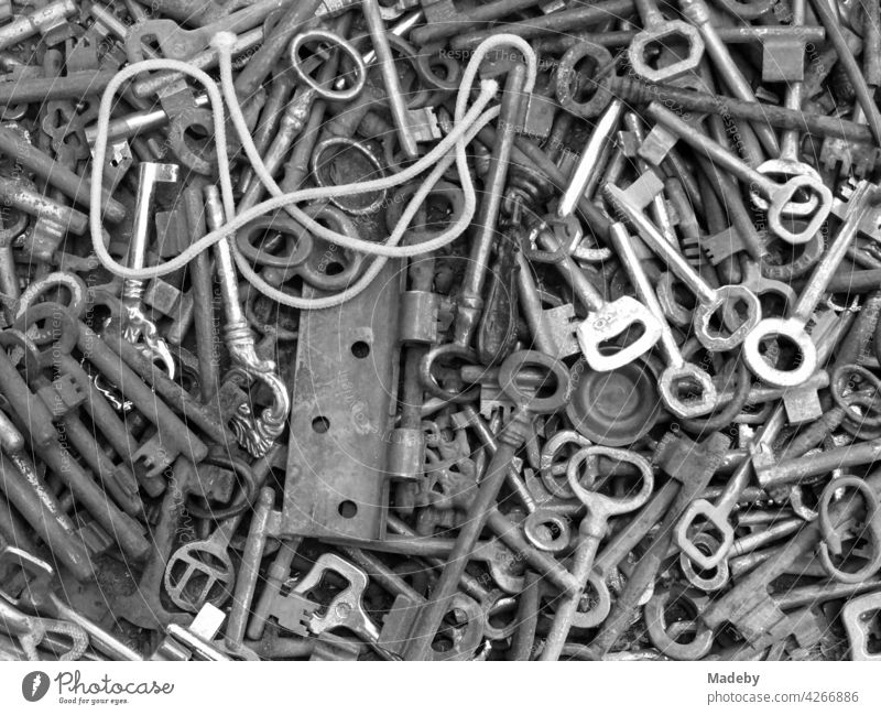 Old iron keys and fittings in front of an antique shop in Bursa, Turkey, photographed in classic black and white Key Metal Scrap iron Access Door lock