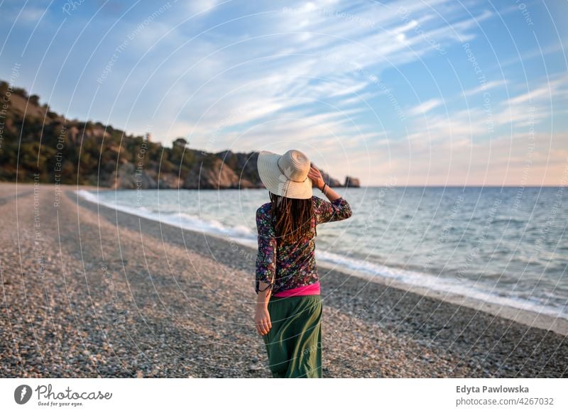 Young woman walking on the beach, Cala del Cañuelo, Andalusia, Spain girl young people beautiful blue one person happy beauty relax lifestyle