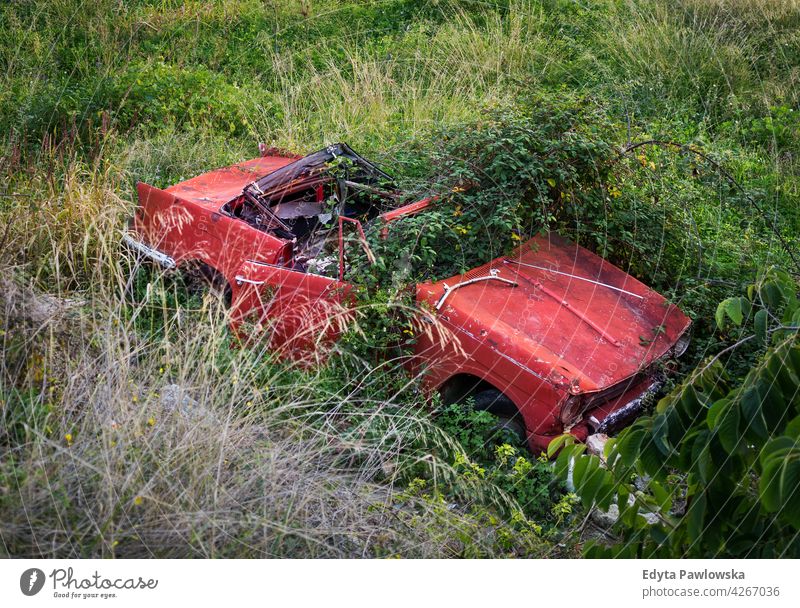 Abandoned wrecked car, Malaga province, Andalusia, Spain red grass accident vintage green Frigiliana Nerja Malaga Province old auto vehicle automobile