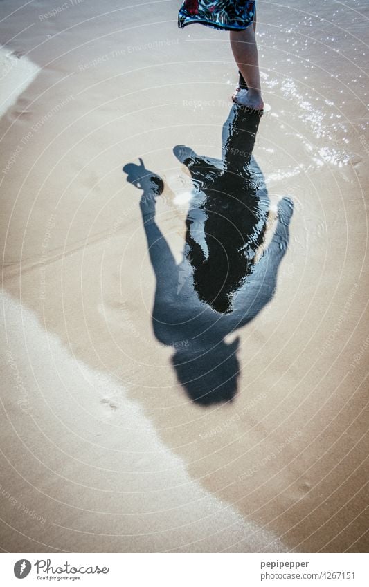 beach walk Shadows in the water Shadow play Dark side Shadowy existence shadow cast Beach Beach dune Walk on the beach Beach life Woman Woman's body