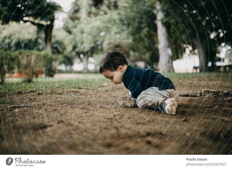 Child playing in the park 1 - 3 years Caucasian Curiosity explore Authentic Nature Happy Lifestyle Happiness Infancy Joy Colour photo Cute Emotions