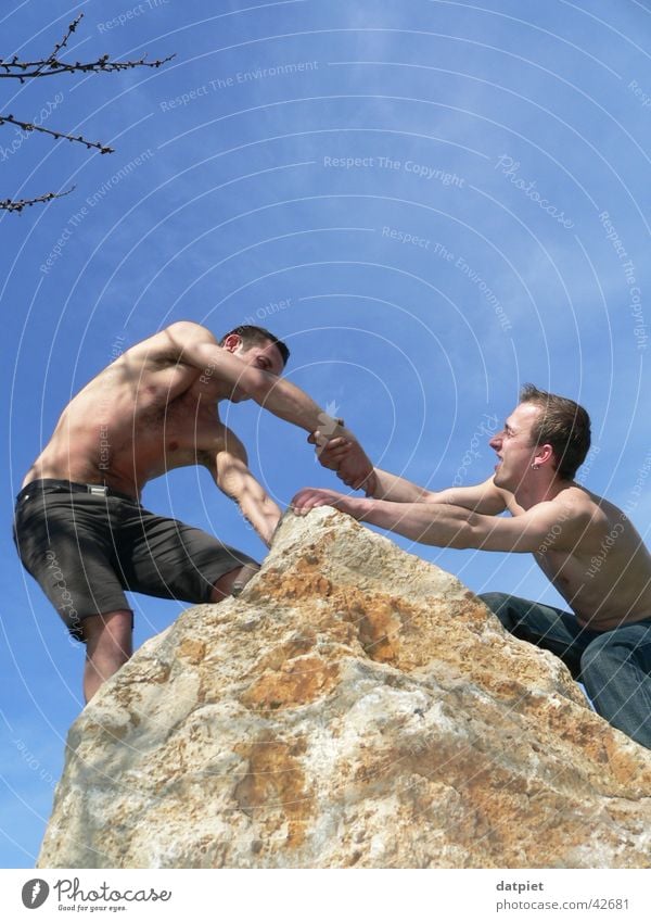 teamwork Healthy Climbing Mountaineering Success Friendship Sky Rock Peak Above Help Teamwork Target Handshake Community service Colour photo Exterior shot