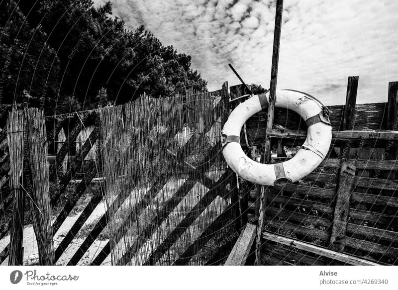 2021 05 29 Marsala abandoned life buoy vintage old lifebuoy background travel blue sea summer landscape nature coast lifeguard water safety beach shore rescue