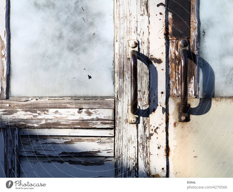 Entrees (40) Wood Wooden door sunny Glass Frosted glass door handle Metal Weathered Broken Old Trashy locked Shadow