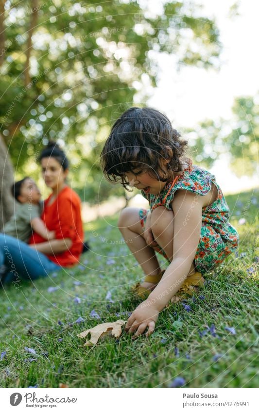 Child playing in the park with family Girl 1 - 3 years 3 - 8 years Family & Relations Brothers and sisters Playing Boy (child) Day Human being Toddler Infancy