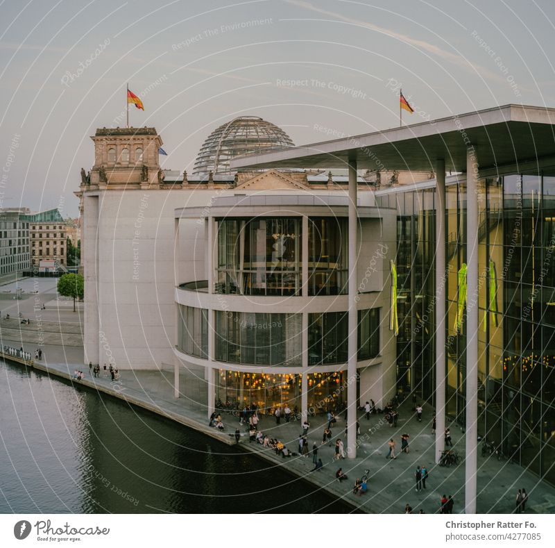 People dancing tango in the evening light in front of the German Bundestag Downtown Tourism Capital city City urban Town Lure of the big city Berlin