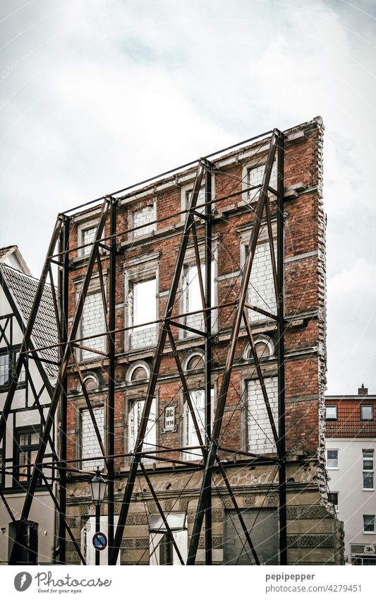 everything only facade - historical house wall secured by a steel construction Facade Architecture House (Residential Structure) Window Building Exterior shot