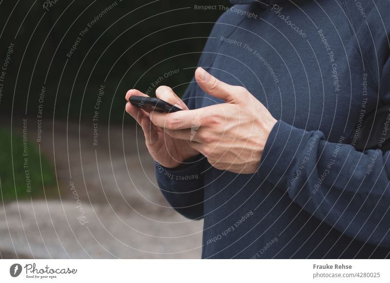 Close up of man busy with black smartphone mobile work hands Cellphone Technology Telephone Internet Hand using Lifestyle Communication Equipment copywriting