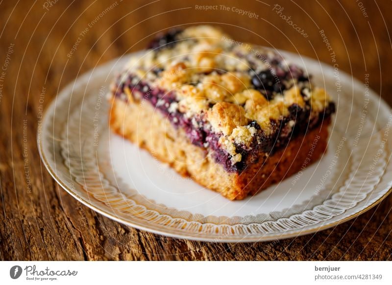 Blueberry pie on dark wood blueberry pie Cake cute Wood Delicious salubriously Close-up Dessert Eating vegan Raw form vegetarian Slice cheese cake embellish