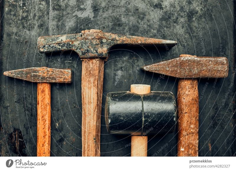 Old hammers on steel surface. Rusty tools for maintenance. Hardware tools to fix. Technical background with copy space metal hardware iron old used heavy useful