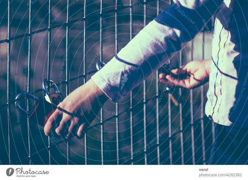 Love Locks, Fence, Child Hands Exterior shot Colour photo Town Happiness Dream Display of affection With love Declaration of love Friendship Love padlock Bridge