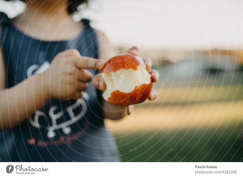 Child holding an apple Apple Fresh Snack close up Authentic Healthy Eating Exterior shot Organic produce Food Delicious Nutrition Colour photo Close-up Fruit