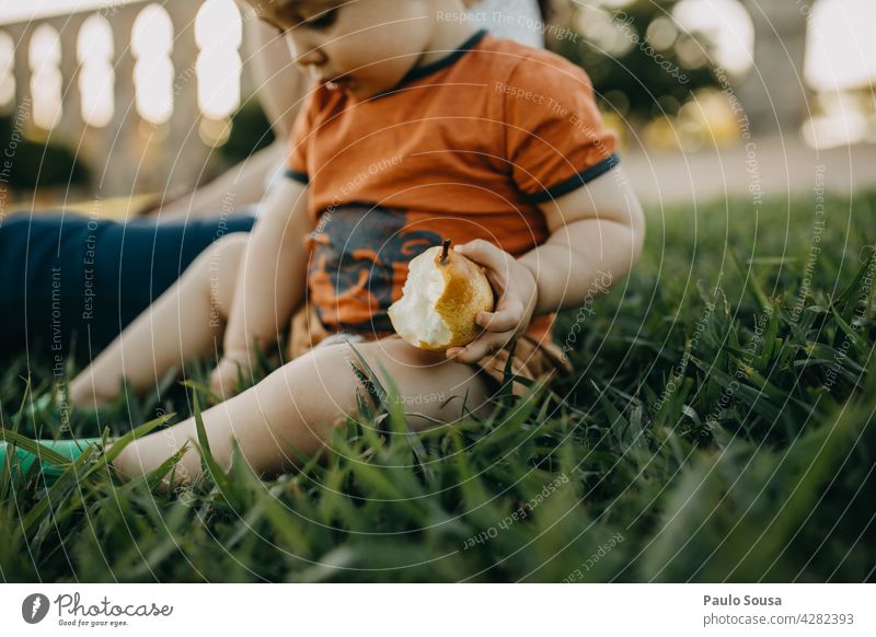 Child eating fresh fruit Caucasian 1 - 3 years Happy Joy Playing Life Colour photo Lifestyle Infancy Happiness Eating Fresh Fruit Snack Healthy Eating Authentic