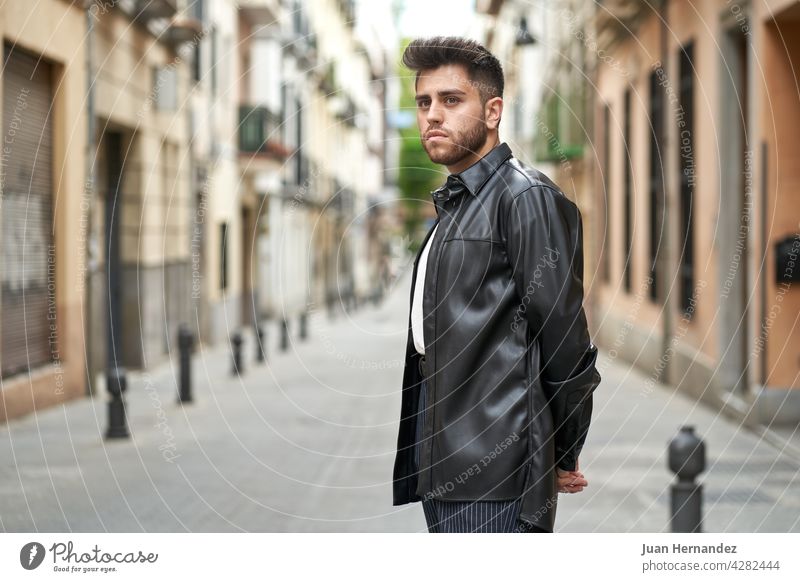 caucasian man with beard, dressed in black leather jacket young guy professional model stylish fashionable handsome shirt standing posing success cool elegant