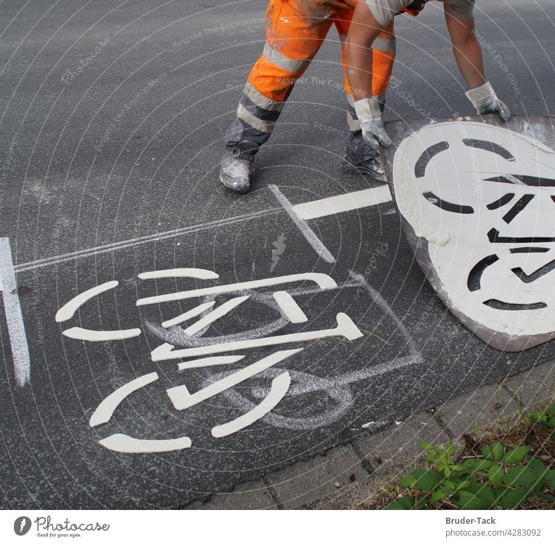 Ground marking works for a bicycle path Ground markings Road marking Lane markings Cycle path Signs and labeling Traffic lane Road traffic Asphalt