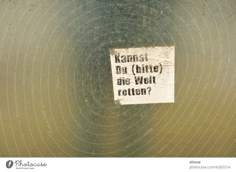 A small white piece of paper with the inscription " Can you (please) save the world ? " sticks to a reflective surface / world improvement Piece of paper