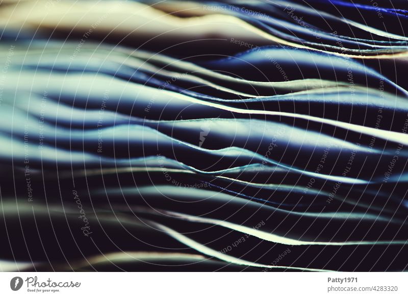 Macro shot of a stack of blue wavy paper Paper Stack crimped Undulating Close-up background Shallow depth of field Structures and shapes edge Detail Pattern