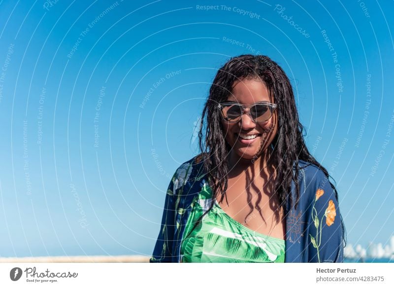 Mixed Race Woman On The Beach On A Sunny Day woman beauty beach summer pretty people outdoors sunny sea relaxing freedom mixed-race peaceful calm happiness sand