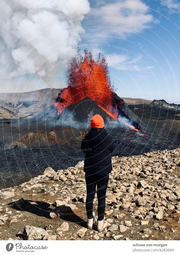 Volcanic eruption in orange Volcano Iceland Fire fountain mountain Nature Landscape Elements Exterior shot Environment Mountain Hot Deserted Climate Water Hill