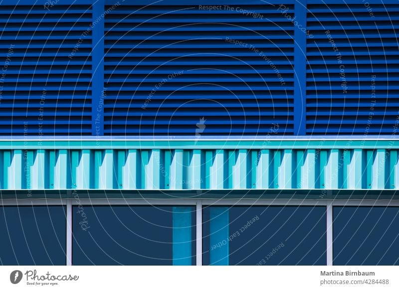 Close up of a blue bulding exterior with windows and blinds turquiose summer structure background technology abstract business architecture modern futuristic