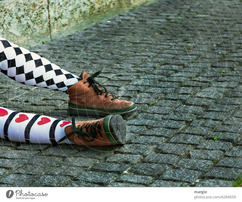 Legs of a girl with different stockings, red hearts and checks and brown shoes fashion-conscious Self-confident Chic courageous Youth (Young adults) Calf