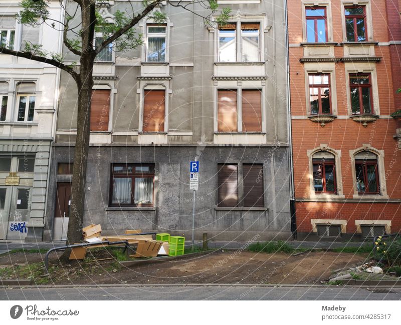 Street scene with empty parking lots, bulky waste and beautiful old buildings in the summer in the Mathildenviertel in Offenbach on the Main in Hesse