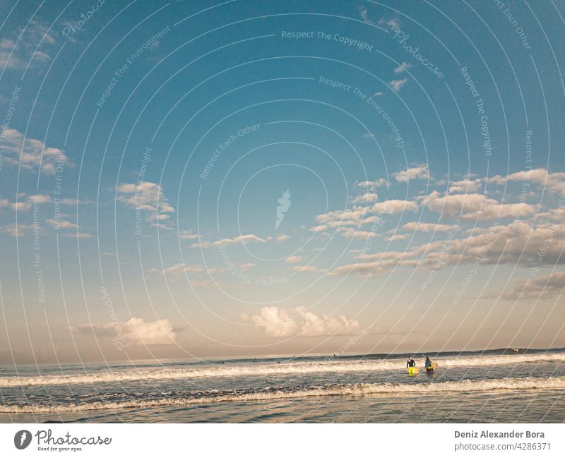 Early morning sunrise, surfers at the beach in Bali Denpasar Seminyak ocean bali seminyak sonnenaufgang ozean cloud natur wasser landschaft sand blau abend