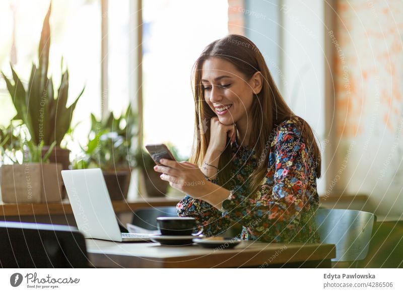 Woman with laptop in cafe people woman young adult casual attractive female smiling happy Caucasian toothy enjoying one person beautiful portrait positivity